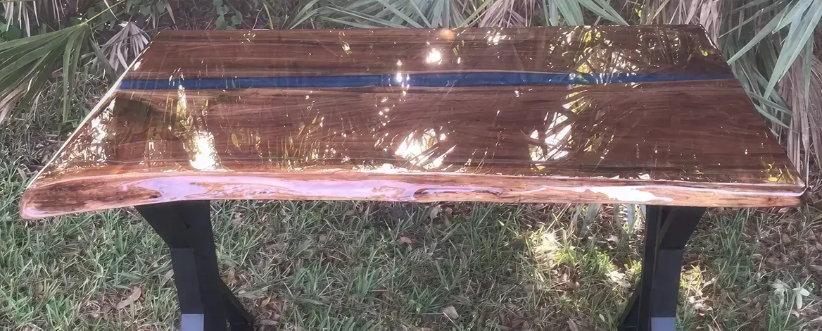 Shiny wooden table with black legs