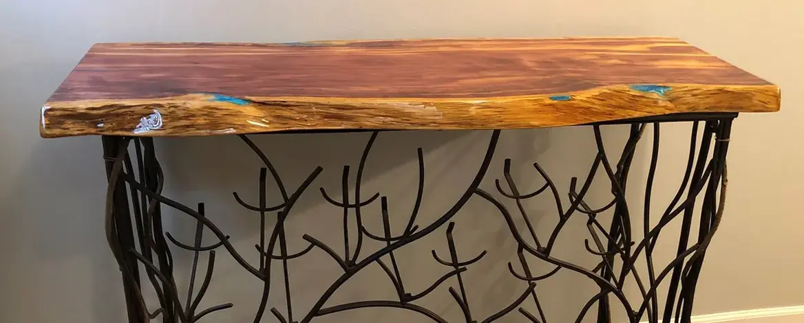 Rustic table with branch-like metal design