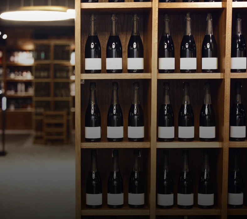 Wine bottles on wooden shelves