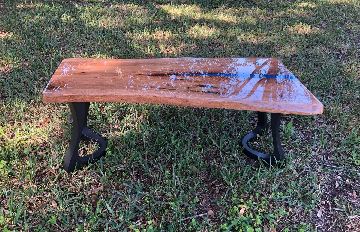Rustic wooden bench on grass