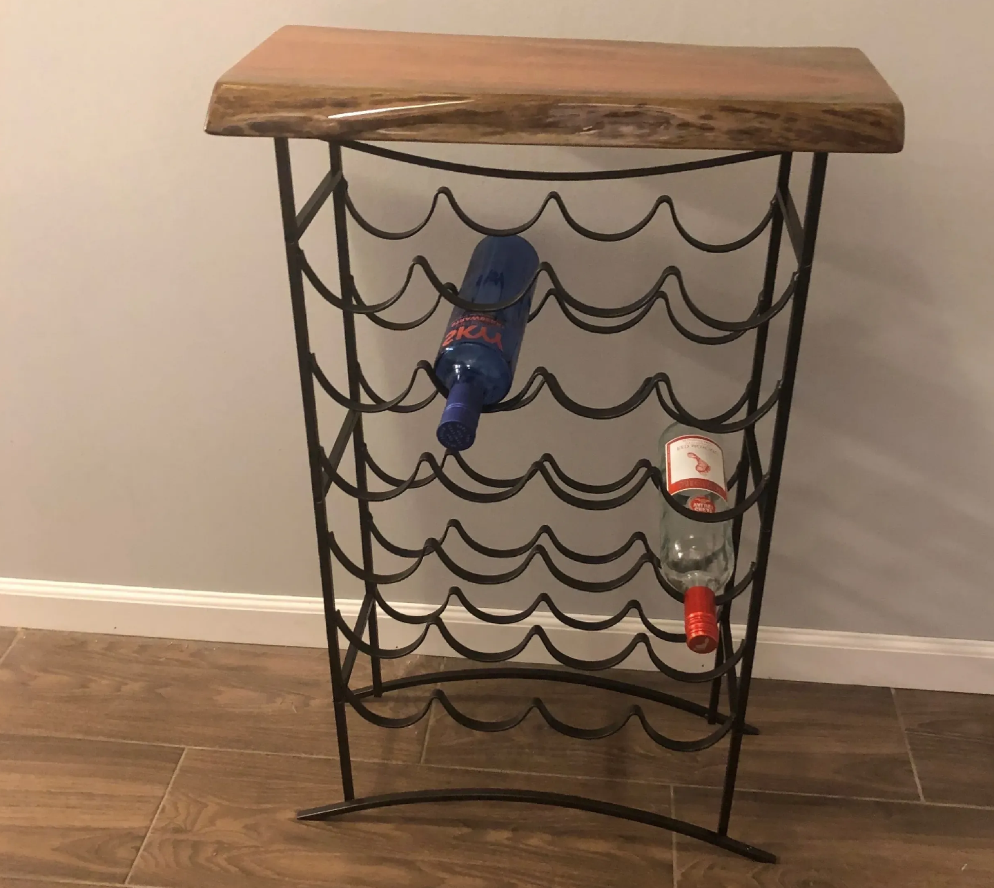 Wooden wine rack with two bottles